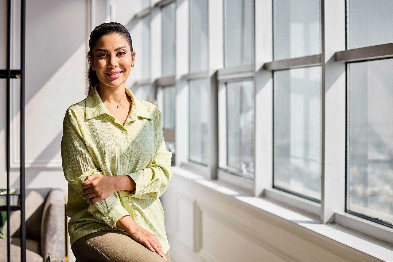 Smiling woman looking out the window